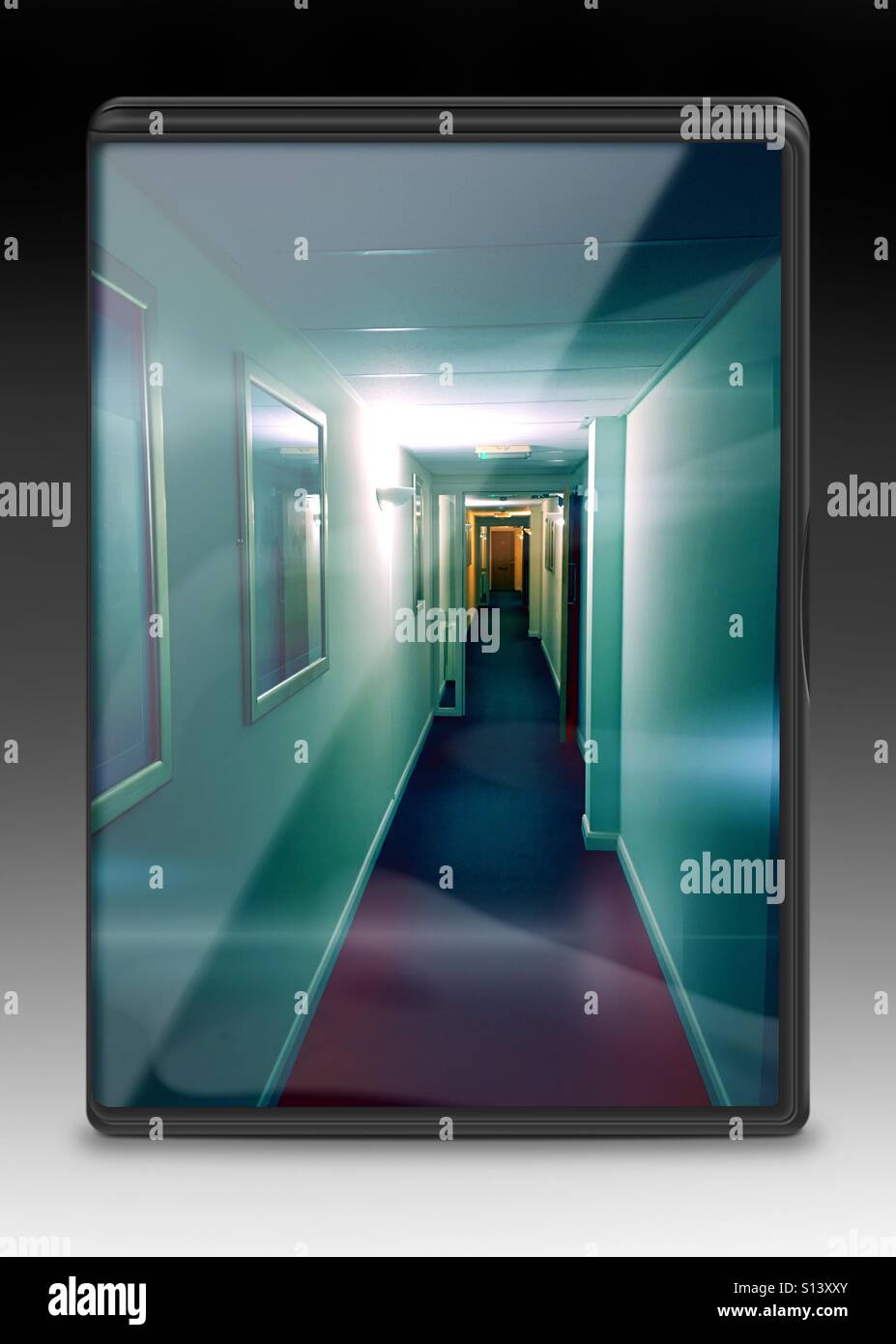 View along a corridor with a door at the end displayed as a DVD cover - Smartphone Captured Stock Image