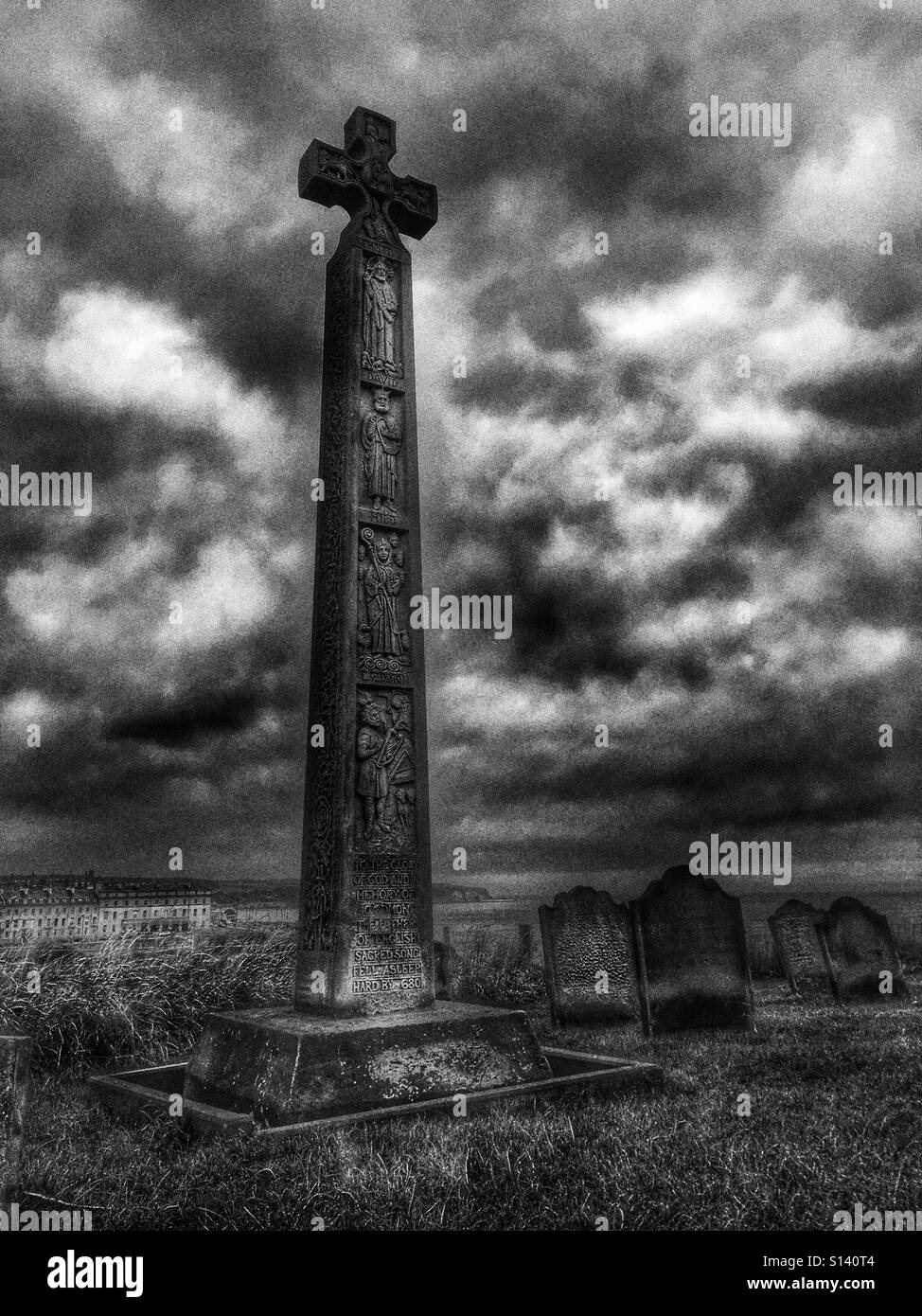 Caedmon's cross within churchyard of St Mary's Church, Whitby, North Yorkshire, England. Stock Photo