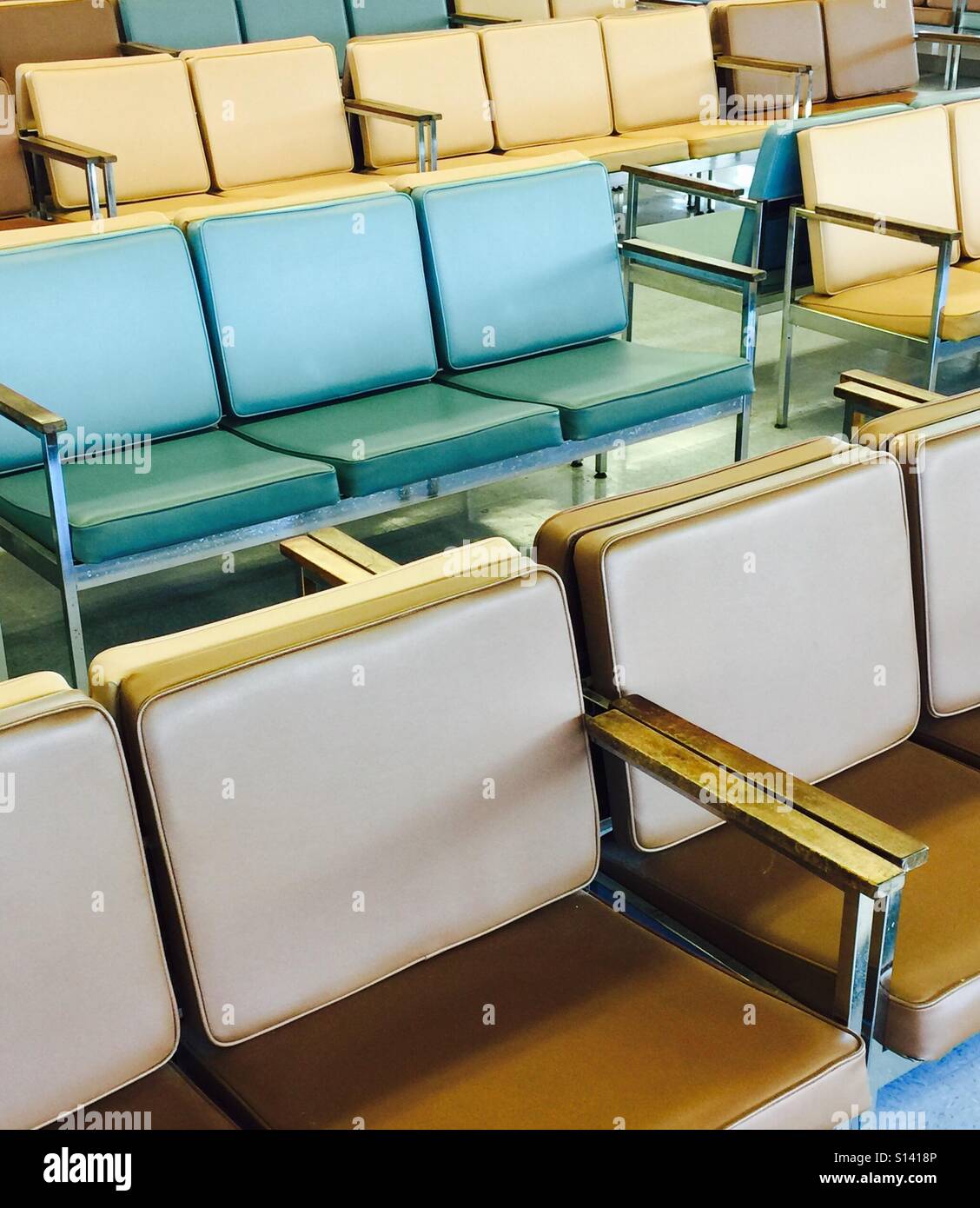 Vintage waiting room seating in pastel colors of blue, yellow and beige - Smartphone Captured Stock Image