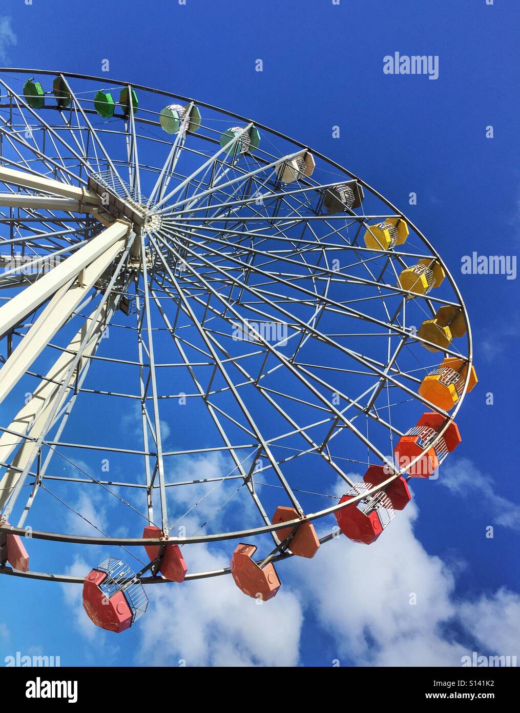 Ferris wheel against a blue summer sky - Smartphone Captured Stock Image