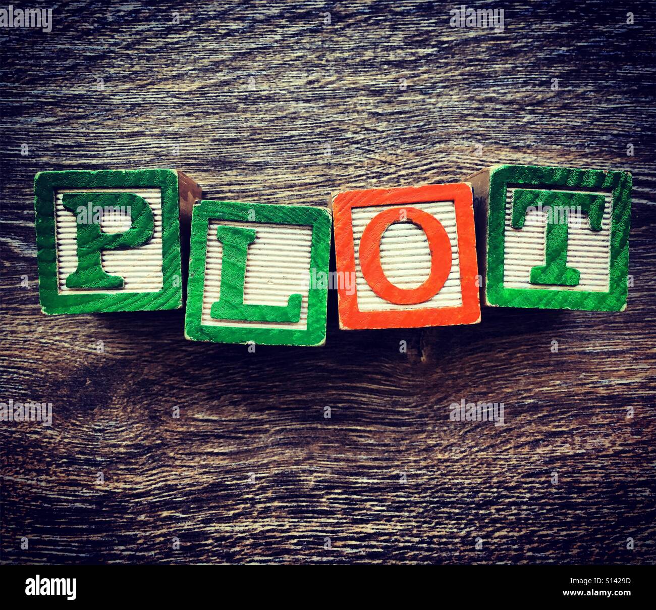 PLOT word written with wood block letter toys Stock Photo ...