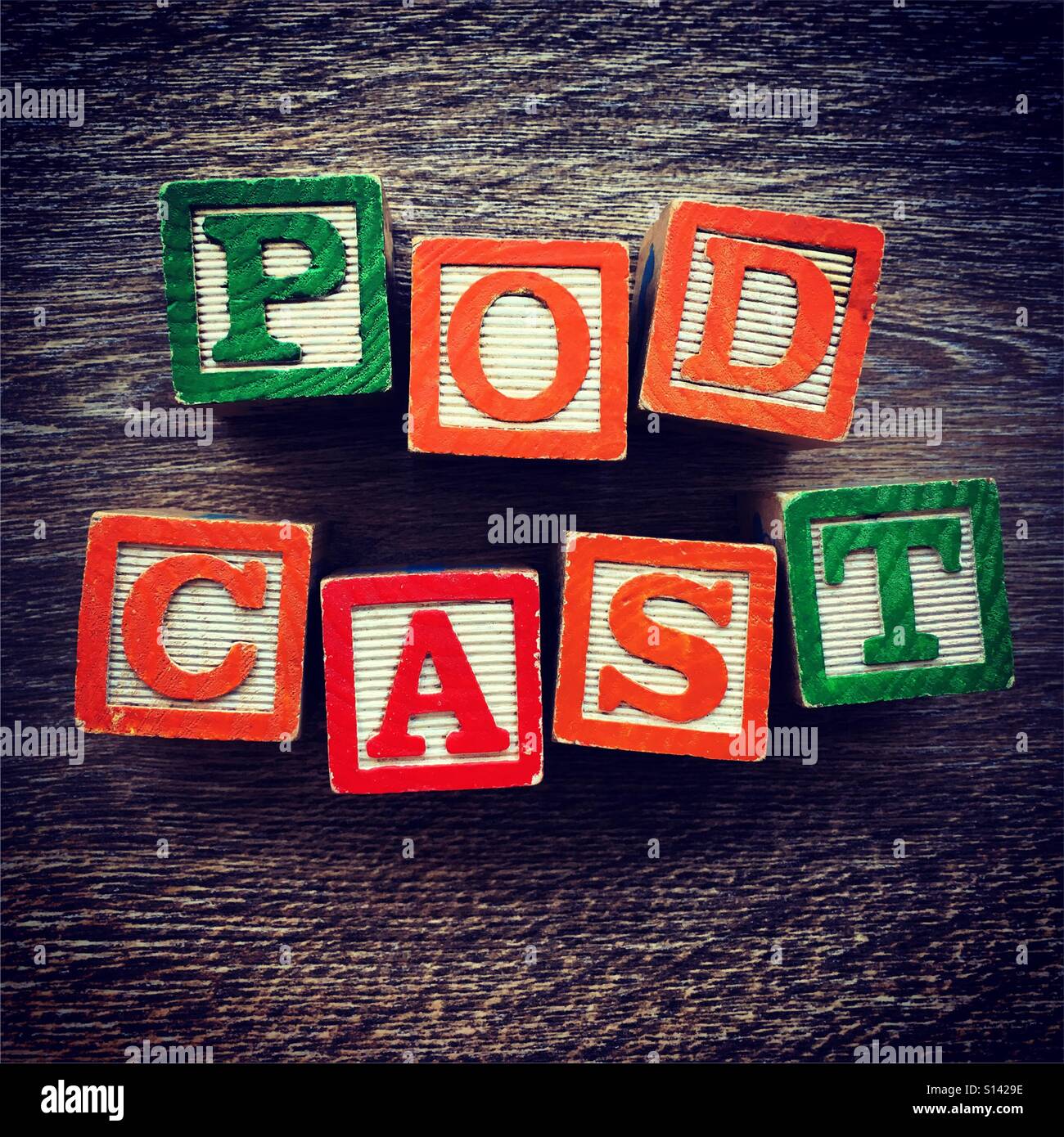 PODCAST word written with wood block letter toys - Smartphone Captured Stock Image