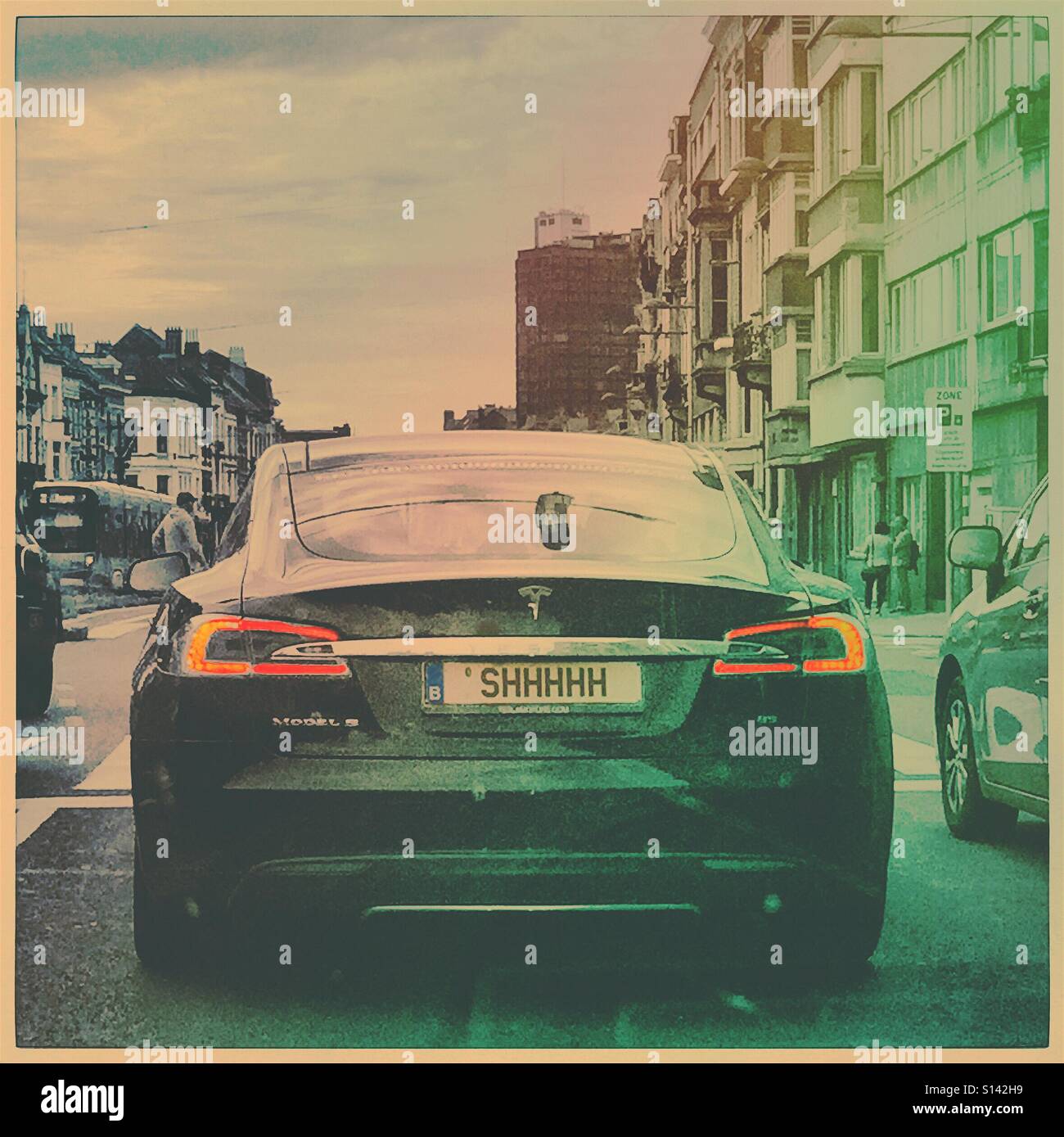 Shhhhhh, Tesla electric car original license plate - Smartphone Captured Stock Image