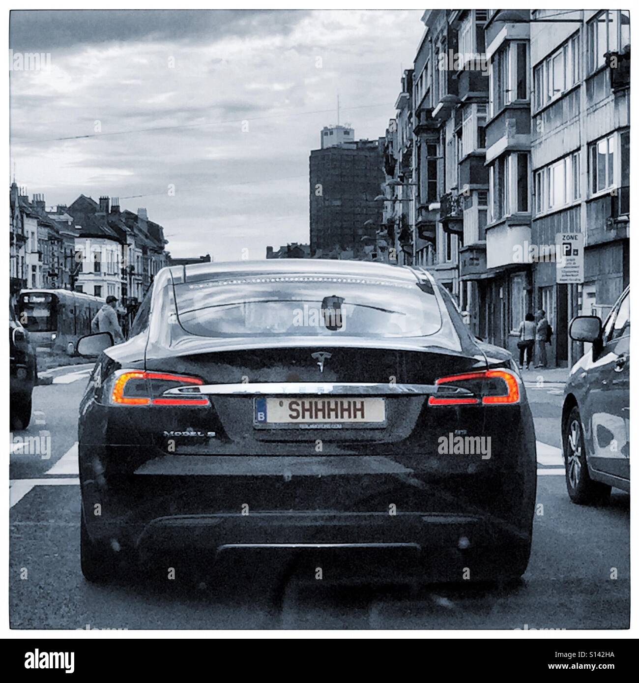 Shhhhhh, Tesla electric car original license plate - Smartphone Captured Stock Image