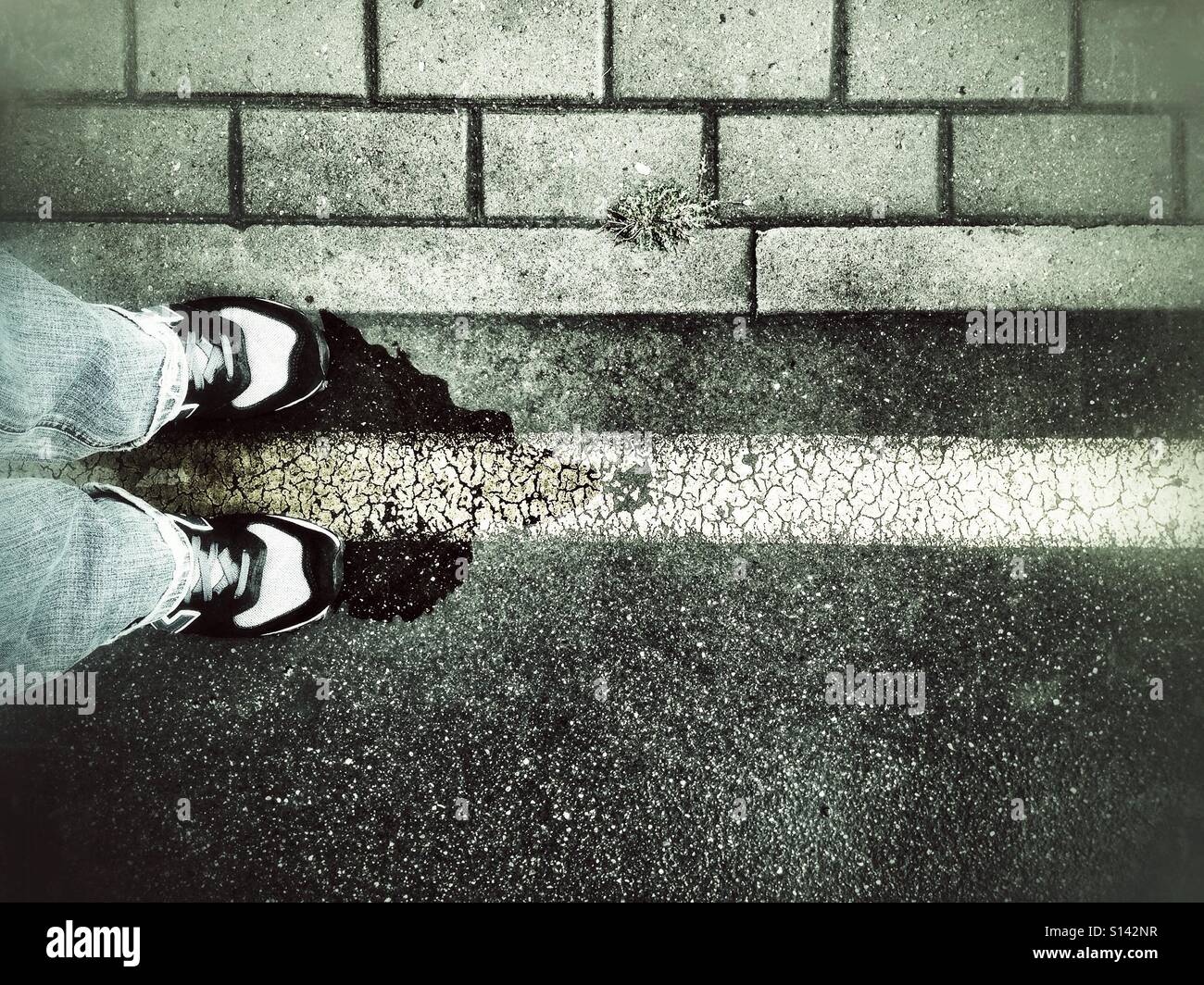 Standing on yellow street line after rain - Smartphone Captured Stock Image