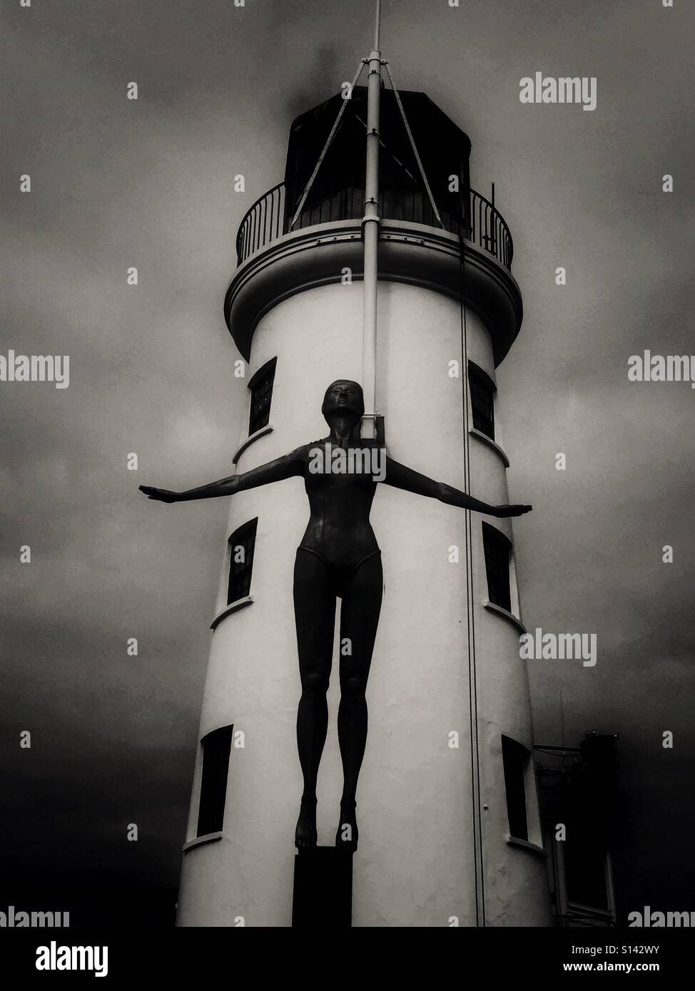 Bathing Belle a statue on the pier at Scarborough in front of the lighthouse. - Smartphone Captured Stock Image