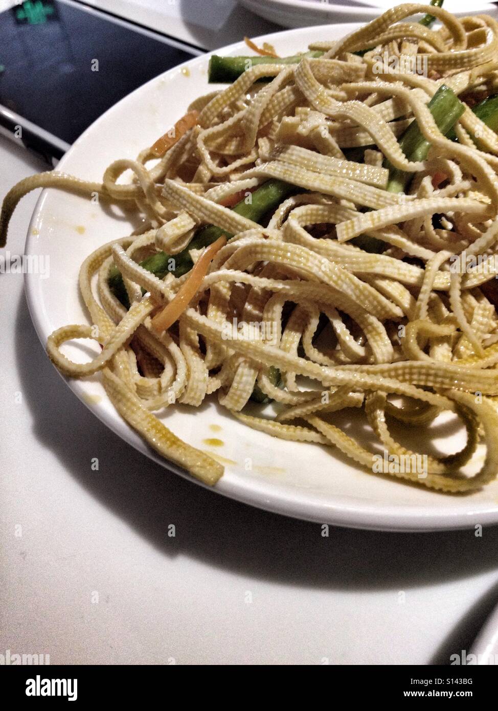 Hot & Spicy Tofu Strips On A Plate, Ready & Waiting To Be Eaten In A Chinese Restaurant, Tofu