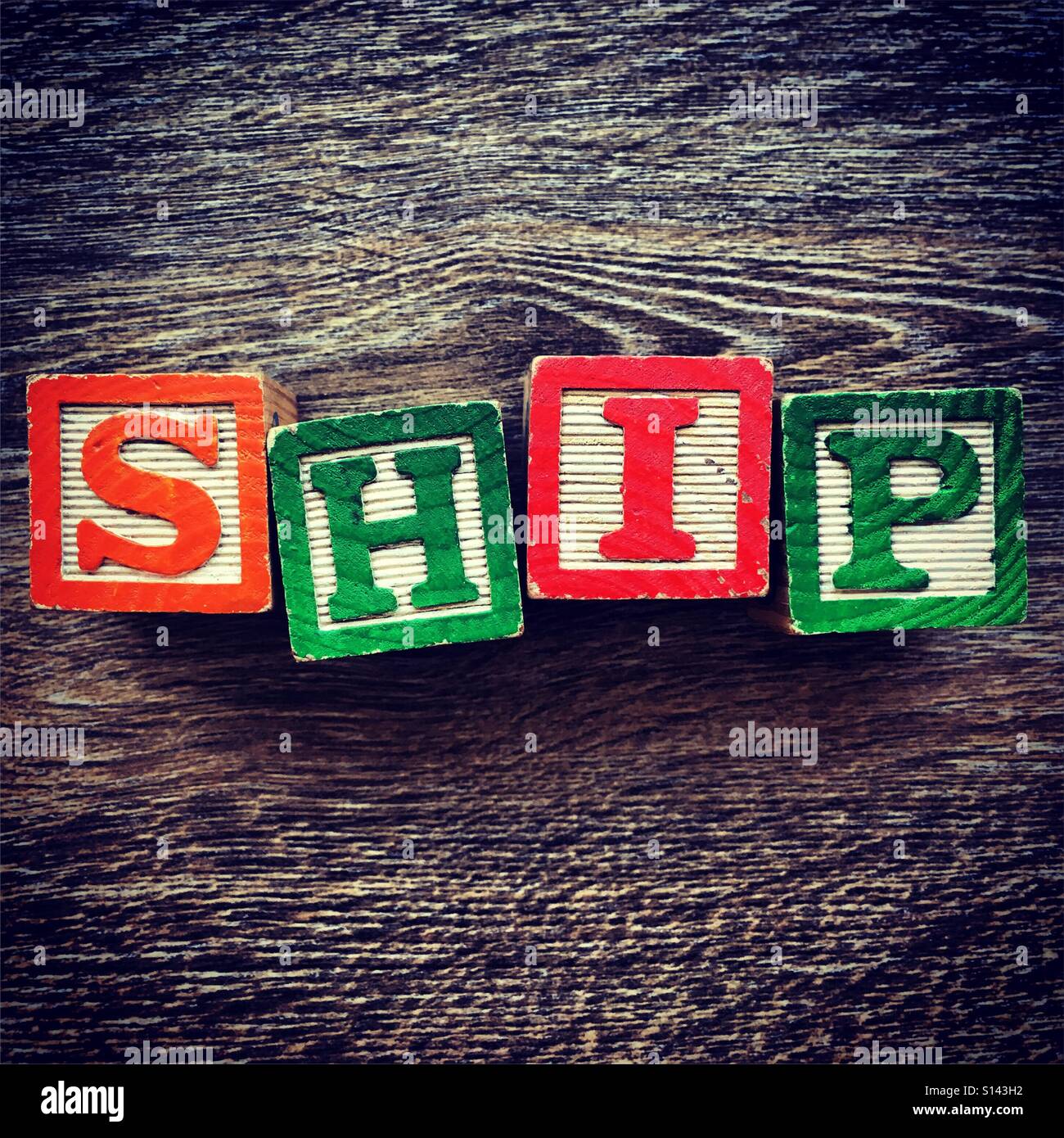 SHIP word written with wood block letter toys - Smartphone Captured Stock Image