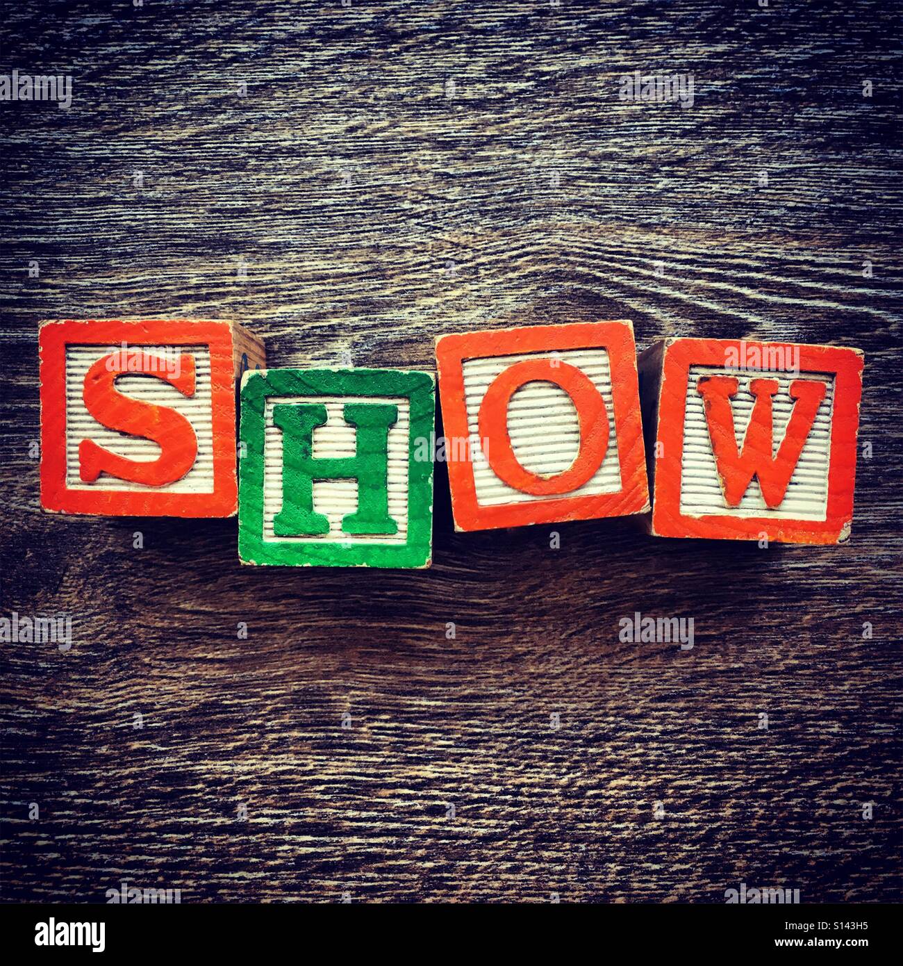 SHOW word written with wood block letter toys - Smartphone Captured Stock Image