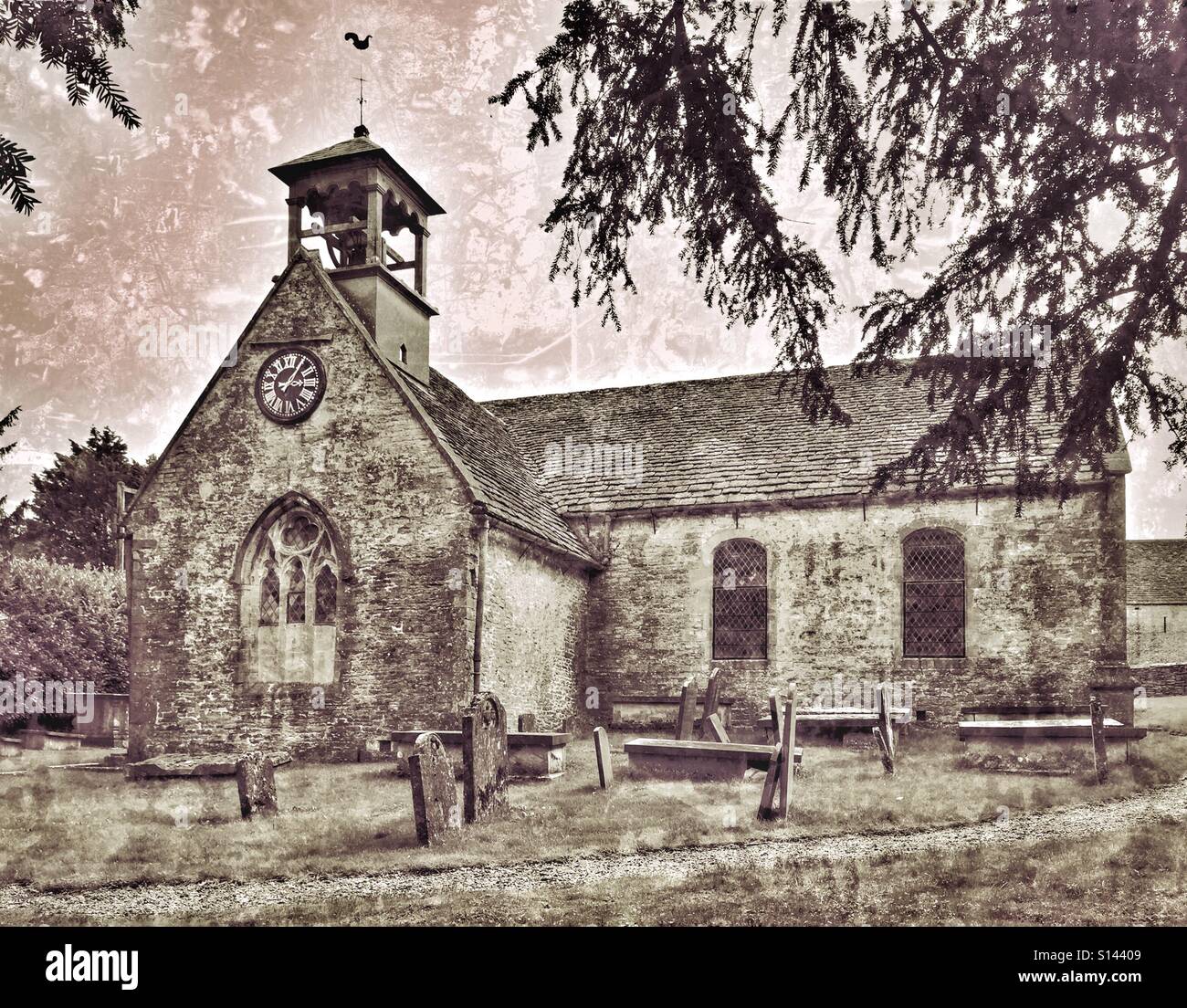 An exterior view of St. Laurence Church in Didmarton, Gloucestershire, England, UK. This Church of England building is unusual in that it has an Open Bell Tower. Photo Credit - © COLIN HOSKINS. - Smartphone Captured Stock Image