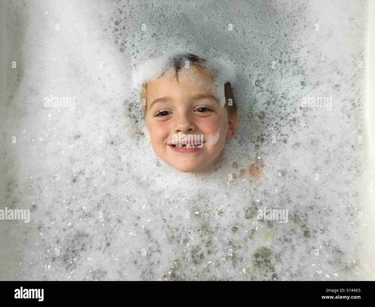 Little boy in bubble bath Stock Photo Alamy