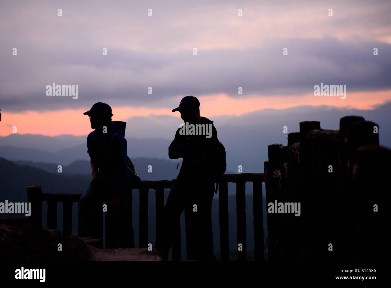Backpackers at the view deck of Mines View Park, Baguio City, Philippines watching sunrise Stock Photo