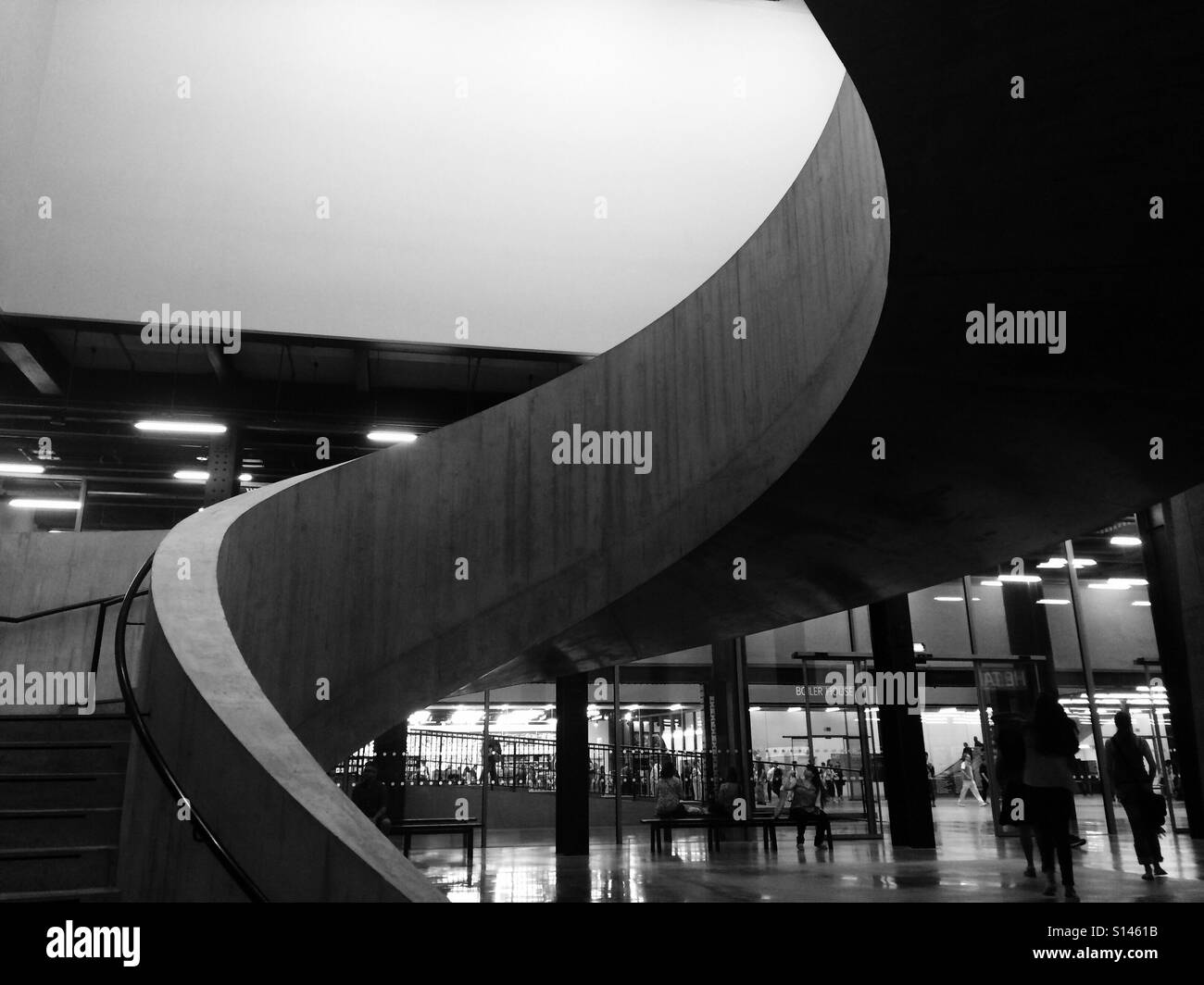 A sweeping concrete staircase creates beautiful lines and leads up to the new extension of the Tate Modern art gallery, Southbank, London. Stock Photo