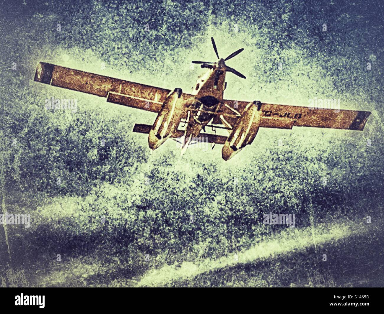 Amphibious aircraft, flying through smoke filled sky with full tanks to fight wild fire. - Smartphone Captured Stock Image