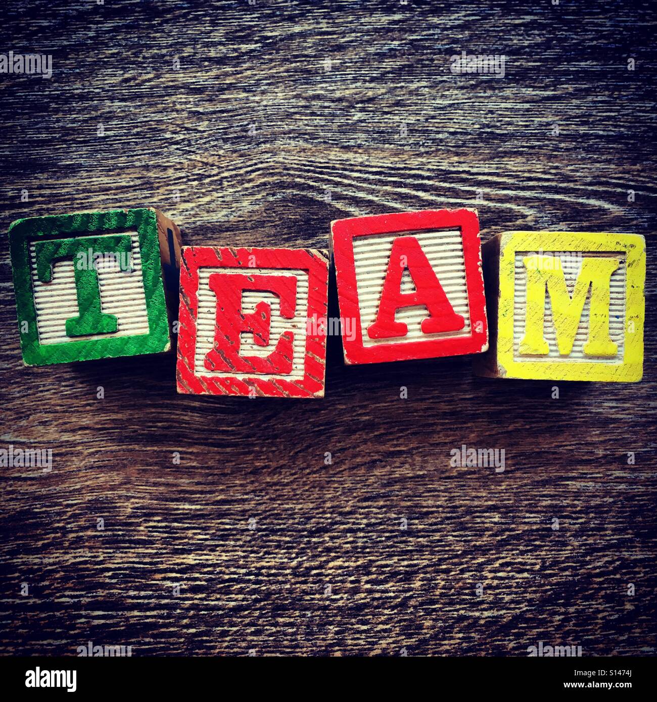 TEAM word written with wood block characters - Smartphone Captured Stock Image