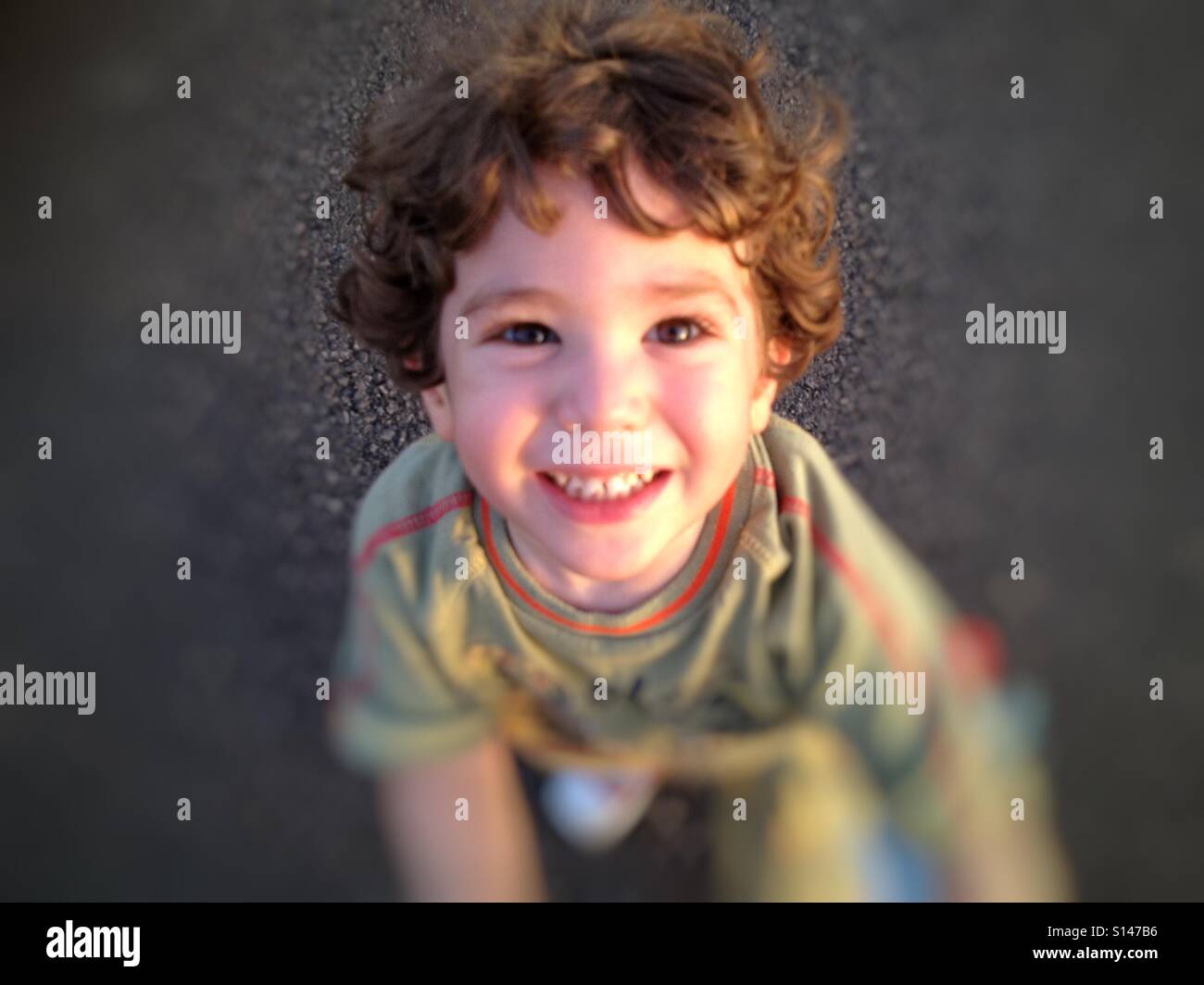 Happy kid looking up happy smiling Stock Photo