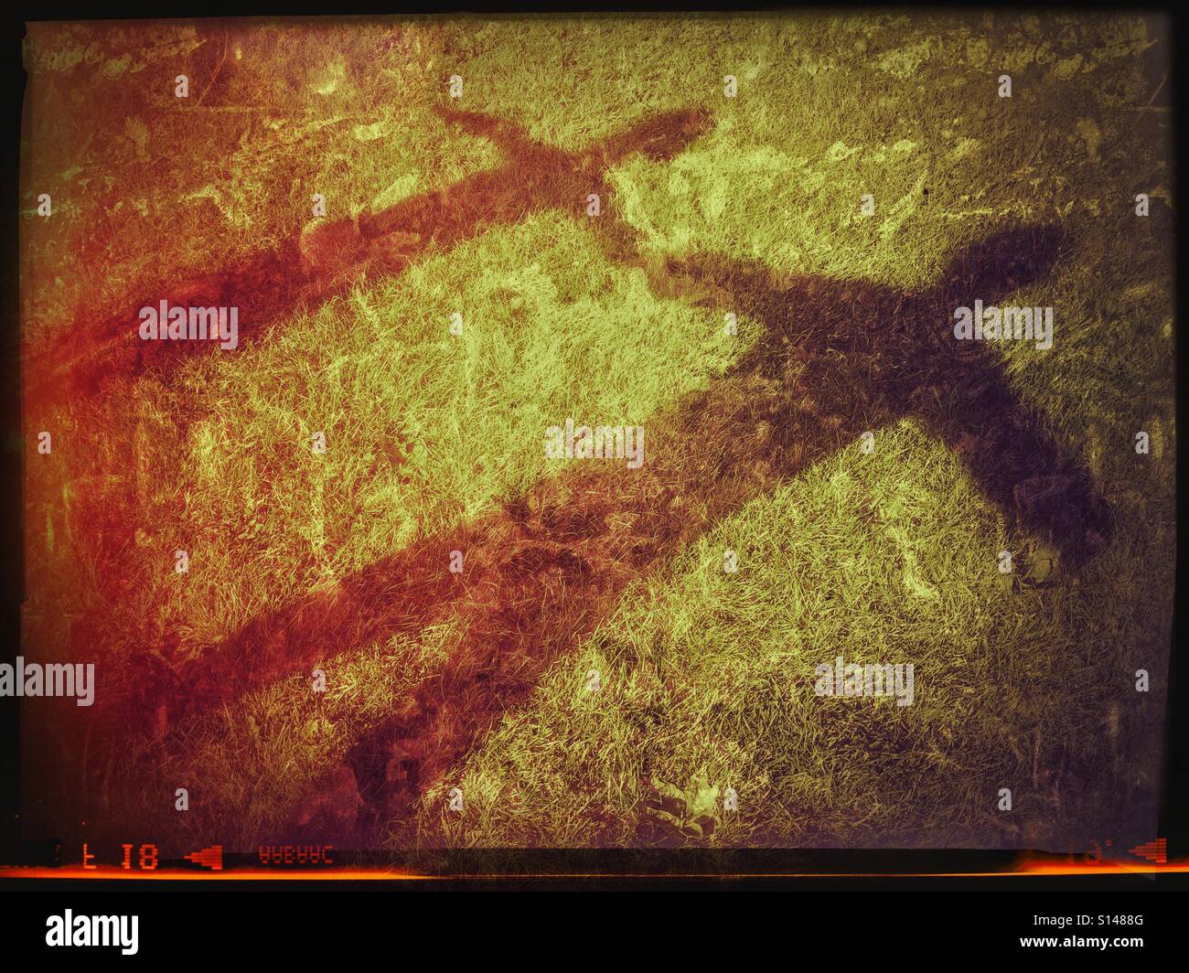 An analogue, film effect image of the shadows of two children holding hands. The larger shadow is a 6 year old boy, the smaller shadow is his 4 year old sister. A picture depicting childhood issues. © - Smartphone Captured Stock Image