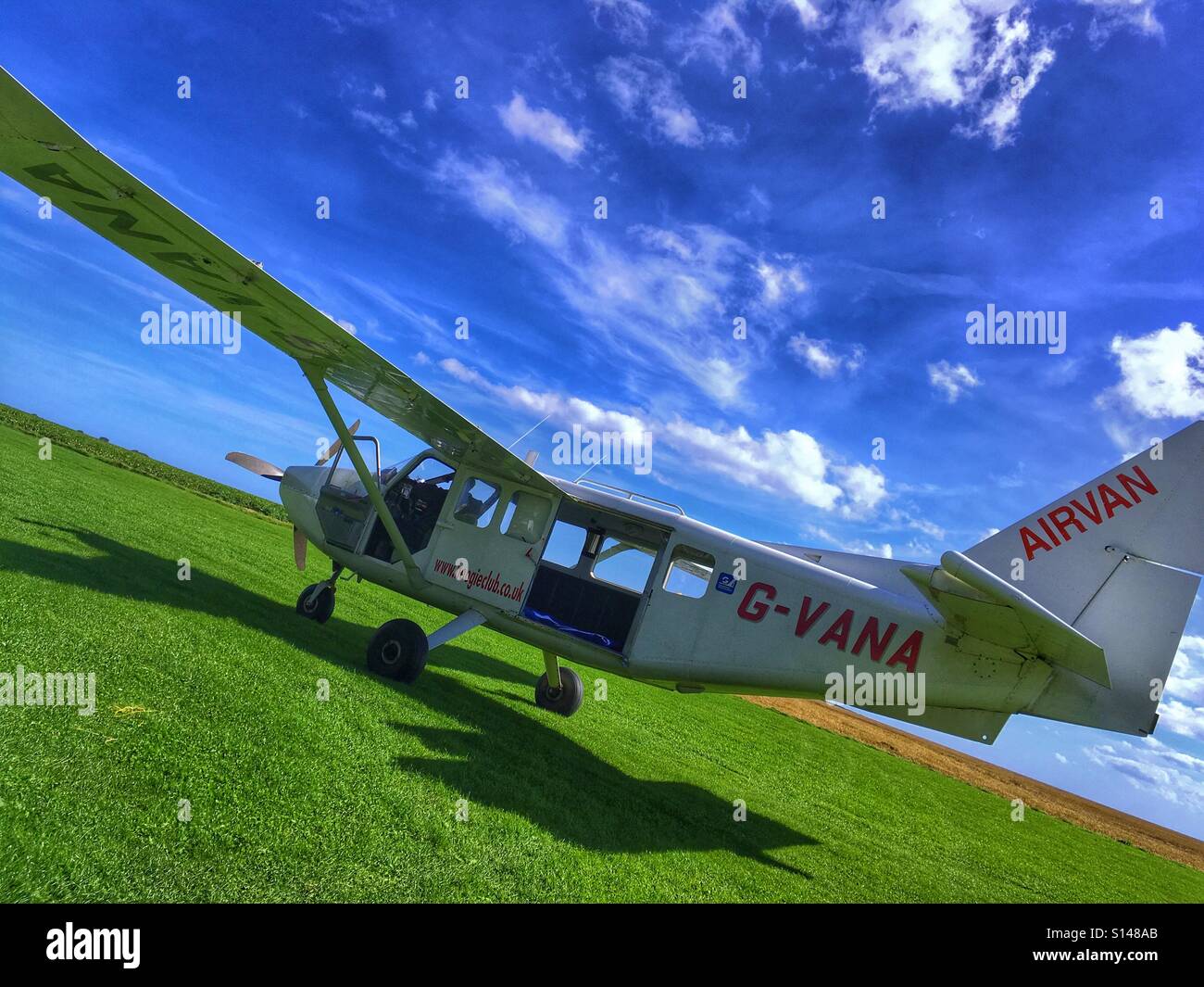 Airvan sky diving aircraft at a grass airfield Stock Photo