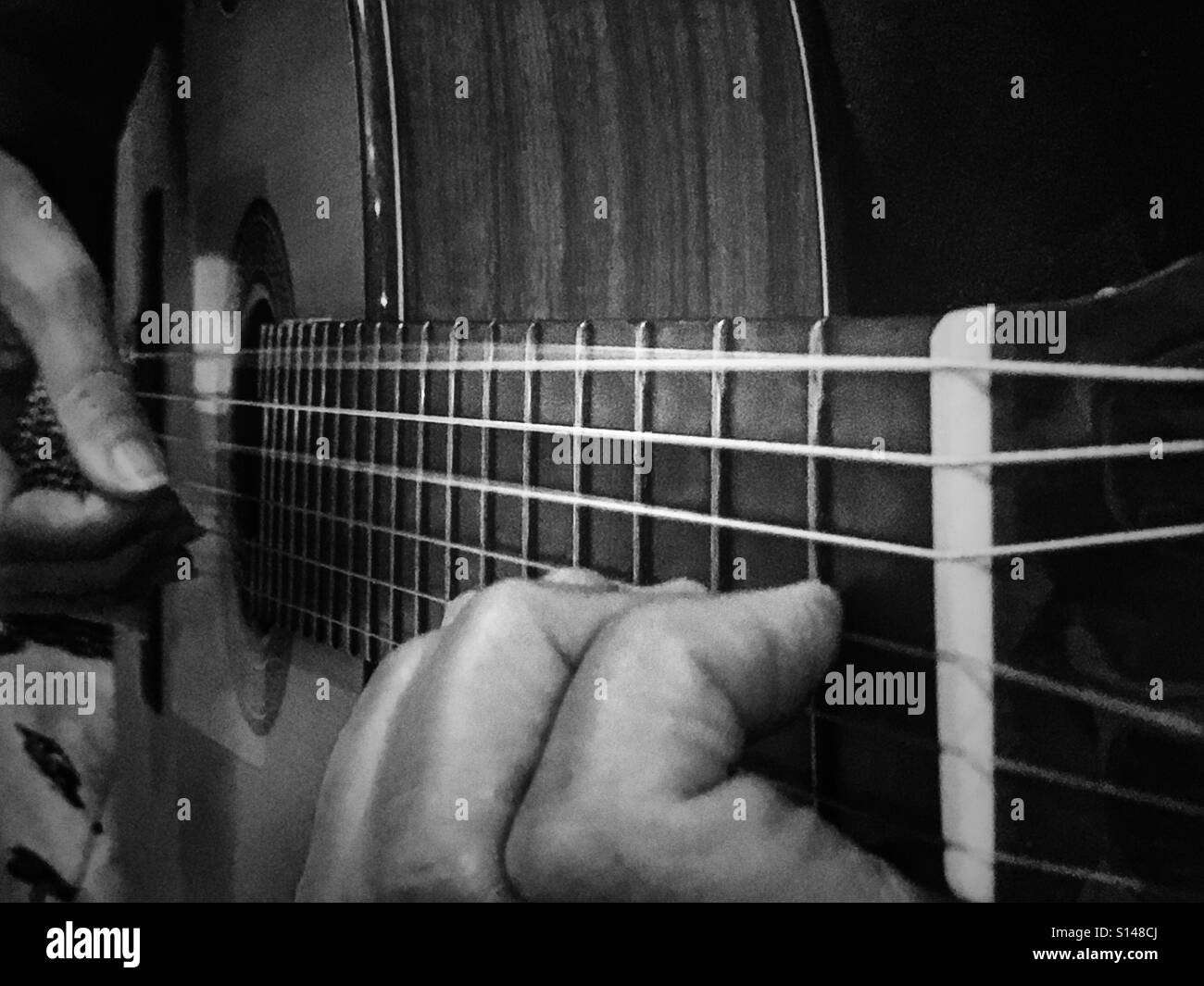 Woman playing classical guitar - Smartphone Captured Stock Image