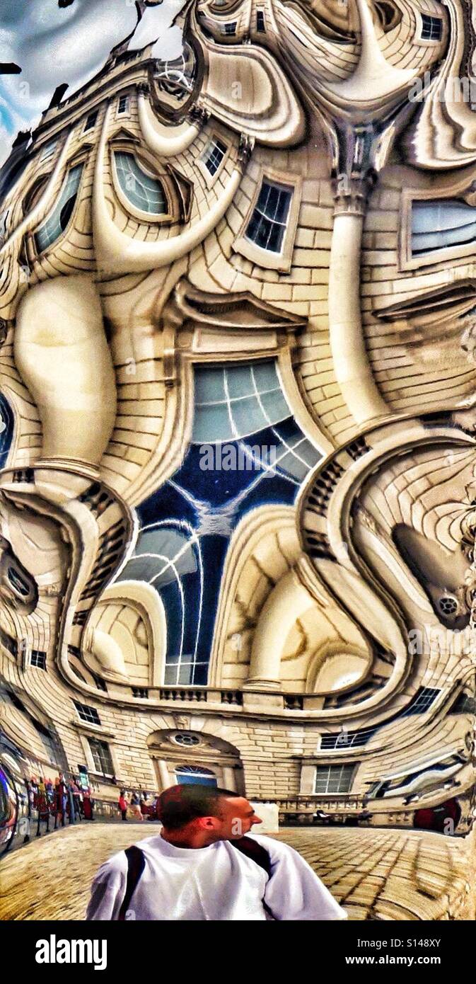 Living in a Picasso World - reflections in the shiny metal sculpture 'Bliss' by the Albanian artist Helidon Xhixha installed at the London Design Biennale Somerset House London 2016 - Smartphone Captured Stock Image