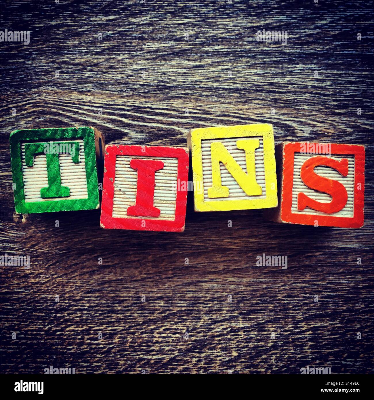 THIS word written with wood block characters - Smartphone Captured Stock Image