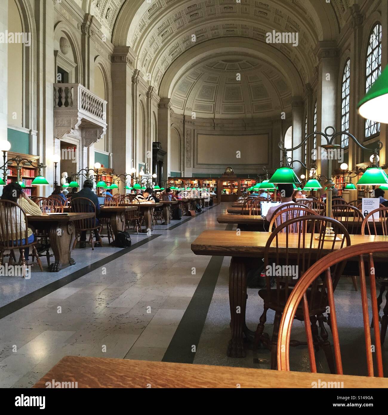 Remote working in library Stock Photo - Alamy