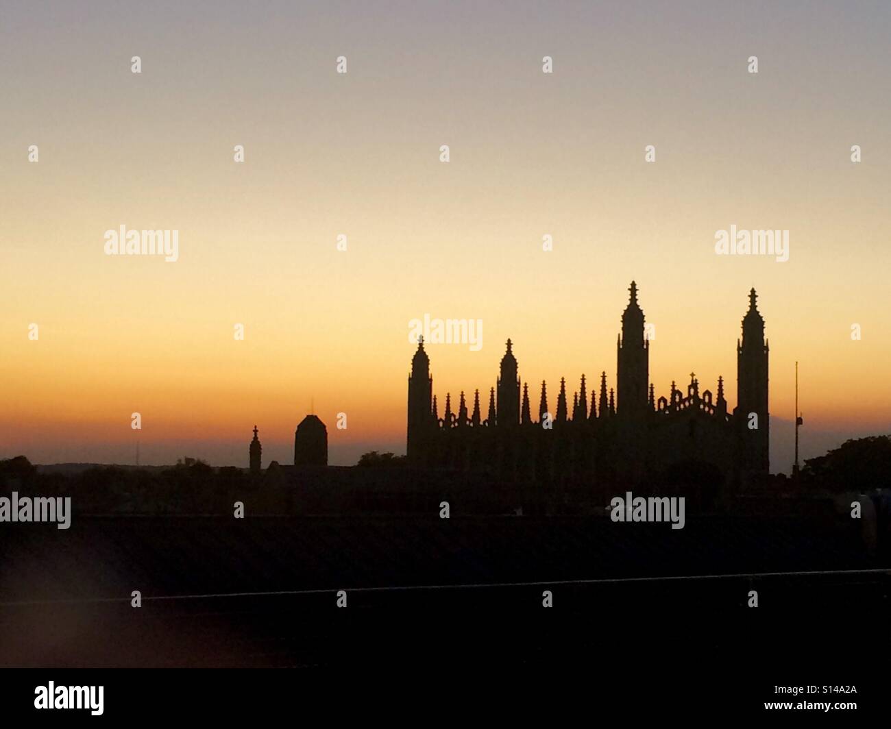 The silhouette of Kings College, University of Cambridge at sunset. Stock Photo