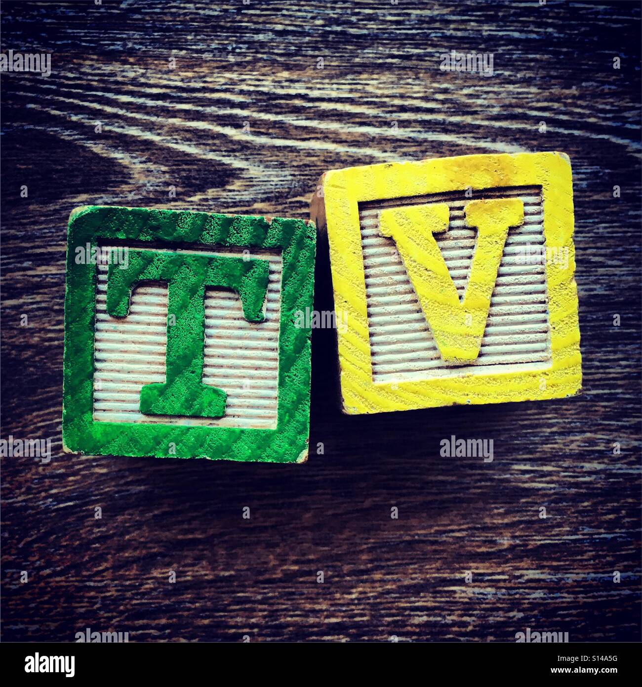 TV word written with wood block characters - Smartphone Captured Stock Image