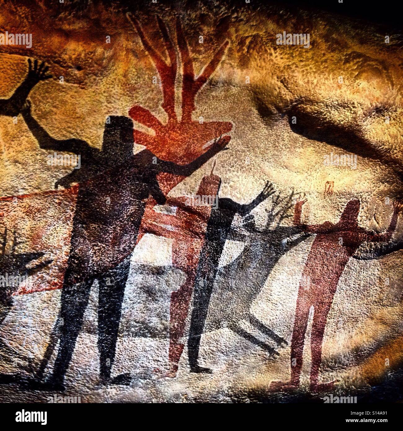 A reproduction of the indigenous mural painted in Sierra de San Francisco caves in Baja California, Mexico City, Mexico, showing deer and red and black man with squared heads. Stock Photo