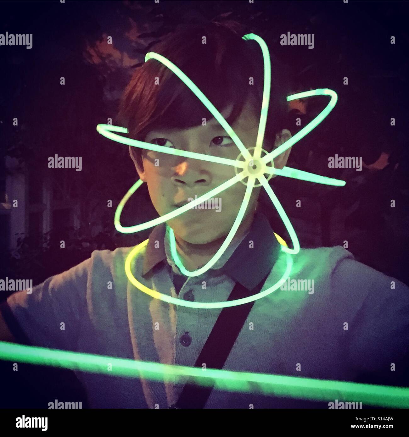 Glowing sticks around the head - Smartphone Captured Stock Image