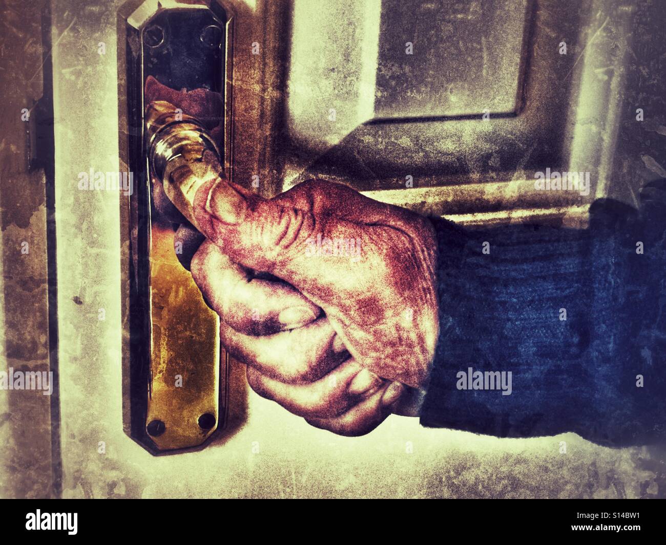 Male hand pulling down on a door handle. - Smartphone Captured Stock Image