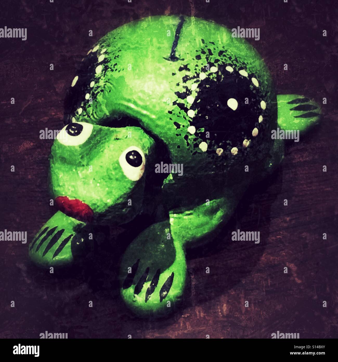 Hand carved and painted wooden tortoise - Smartphone Captured Stock Image