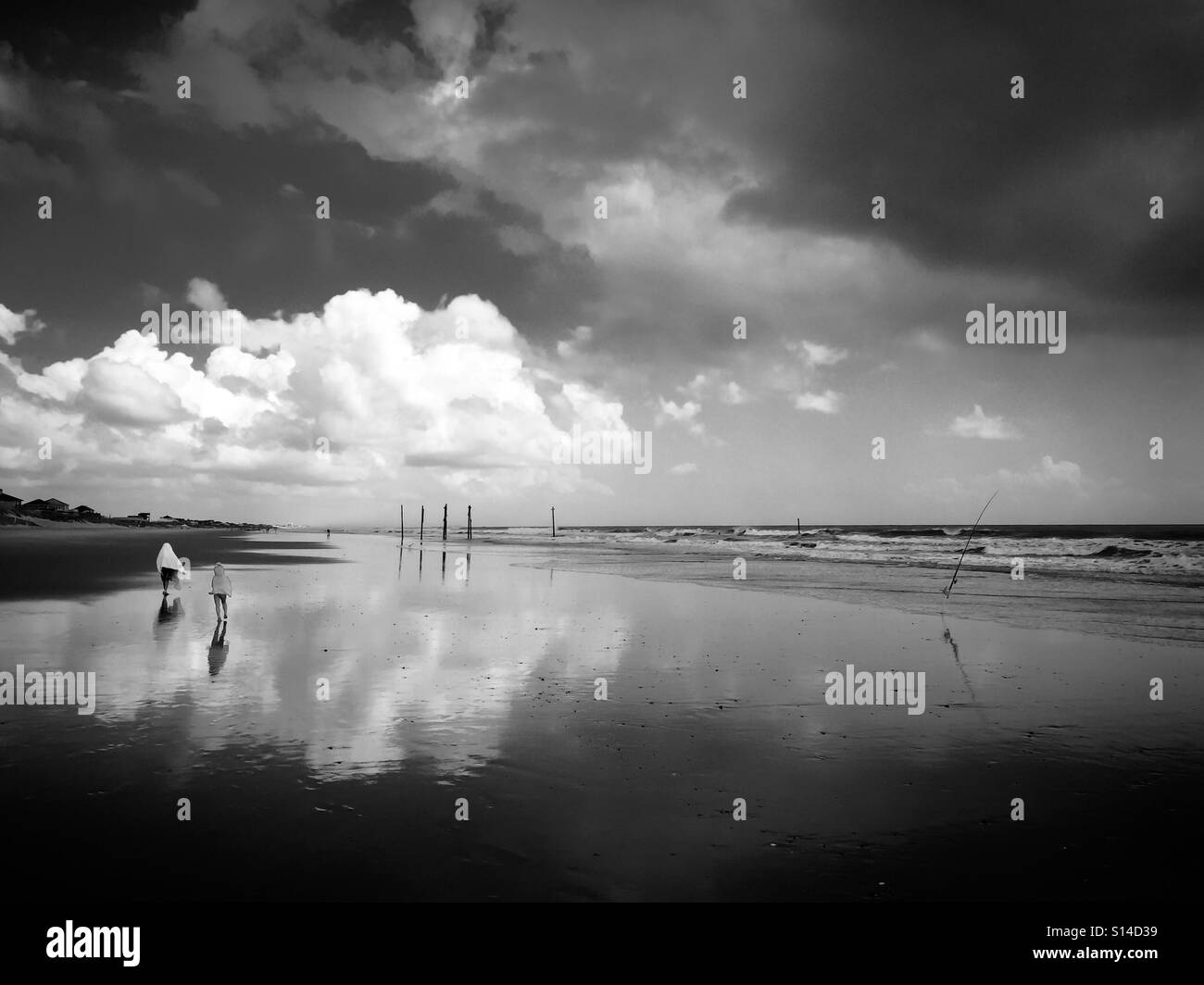 Brother And Sister Walking On Beach Stock Photo Alamy