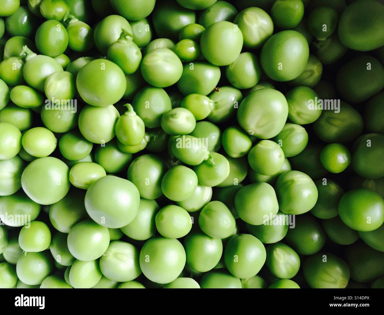 Fresh raw green peas Stock Photo