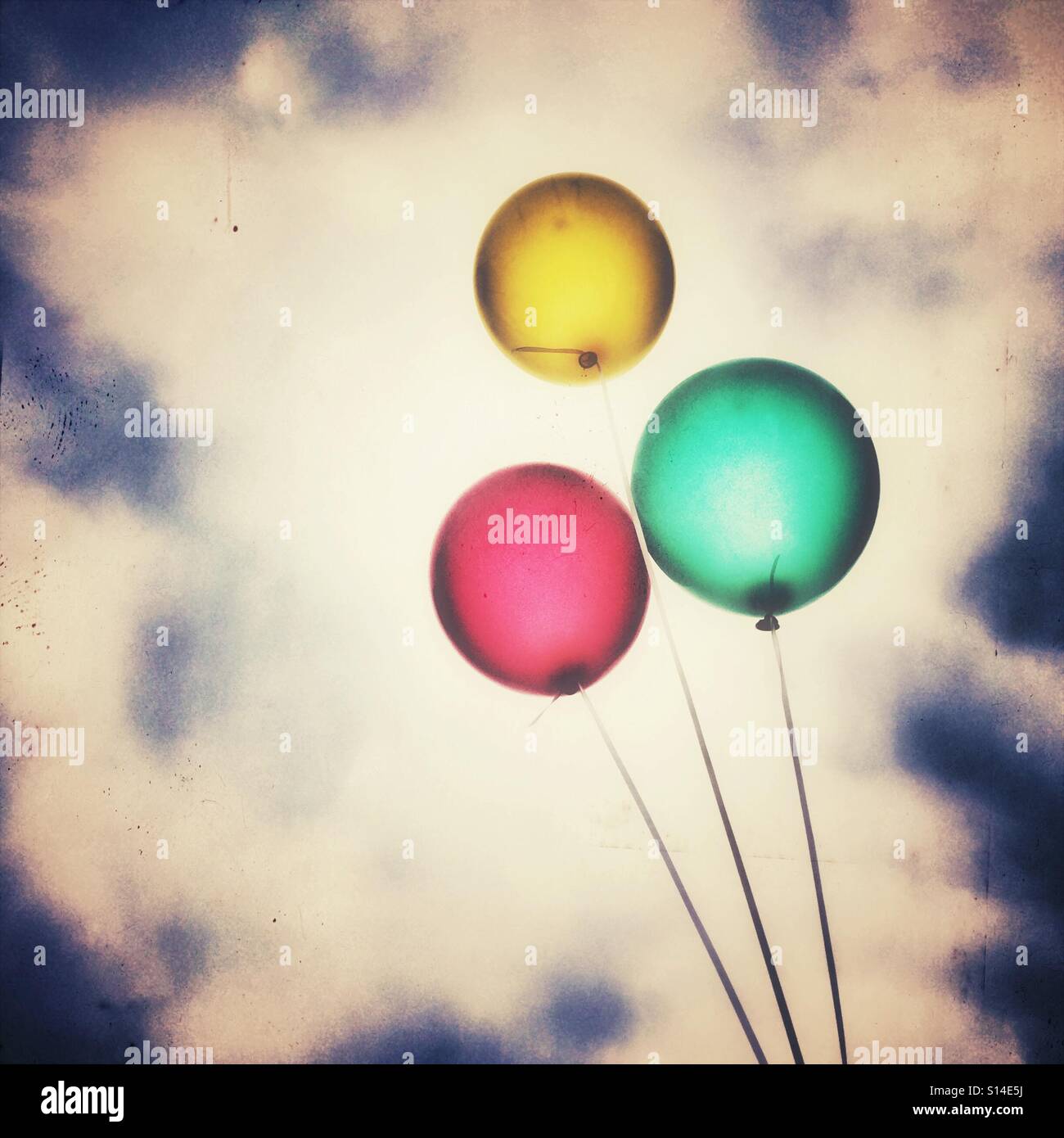 Red, yellow and green balloons against the sky - Smartphone Captured Stock Image