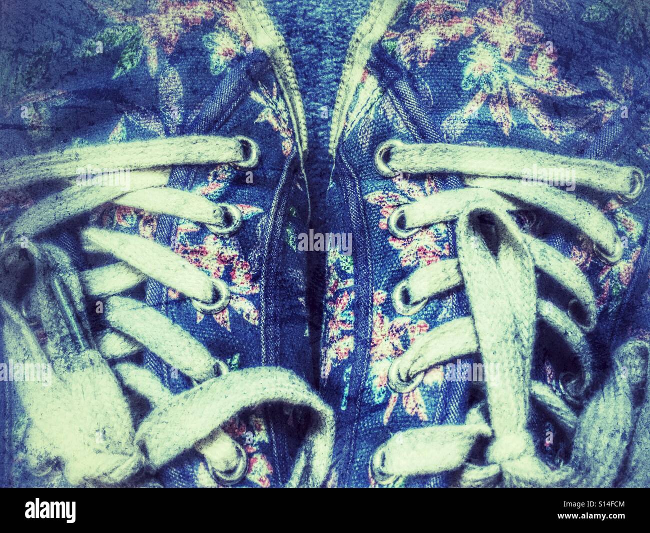 Shoe laces on blue canvas shoes - Smartphone Captured Stock Image