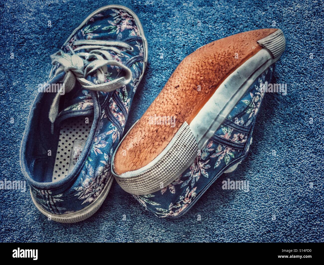 Blue canvas shoes on the floor. - Smartphone Captured Stock Image