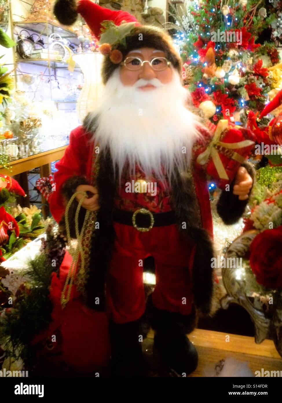 Father Christmas doll in red coat - Smartphone Captured Stock Image