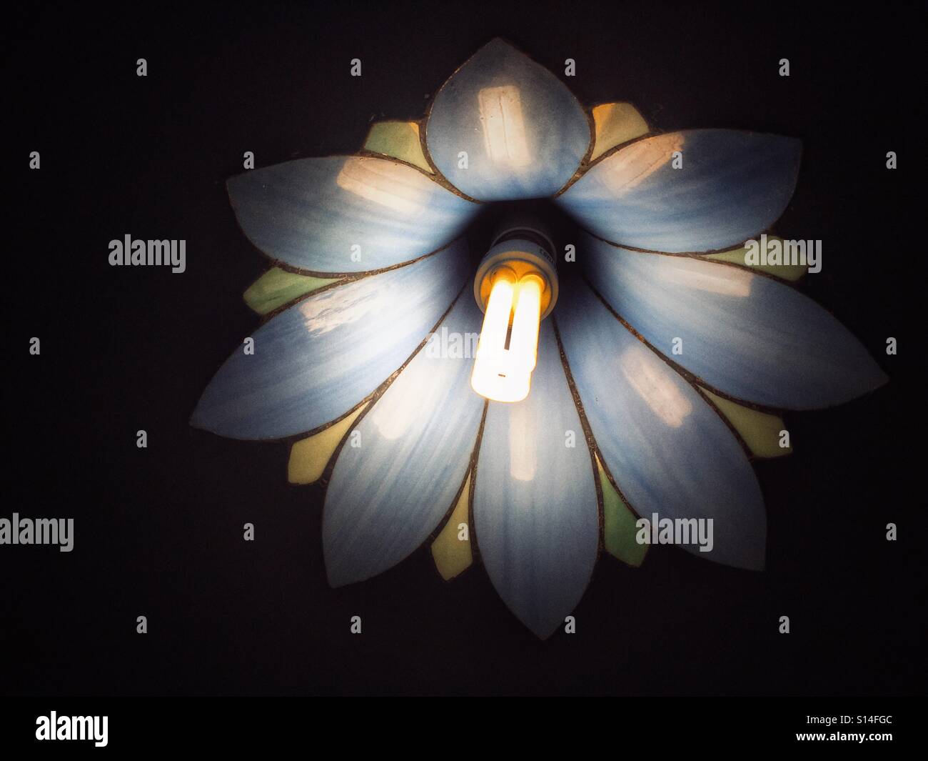 Ceiling light fitted with glass lampshade and low energy lightbulb - Smartphone Captured Stock Image