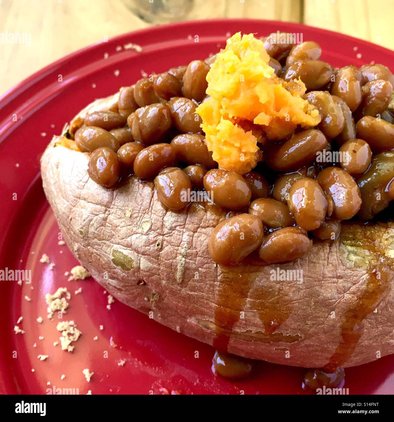 Baked sweet potato with beans Stock Photo Alamy