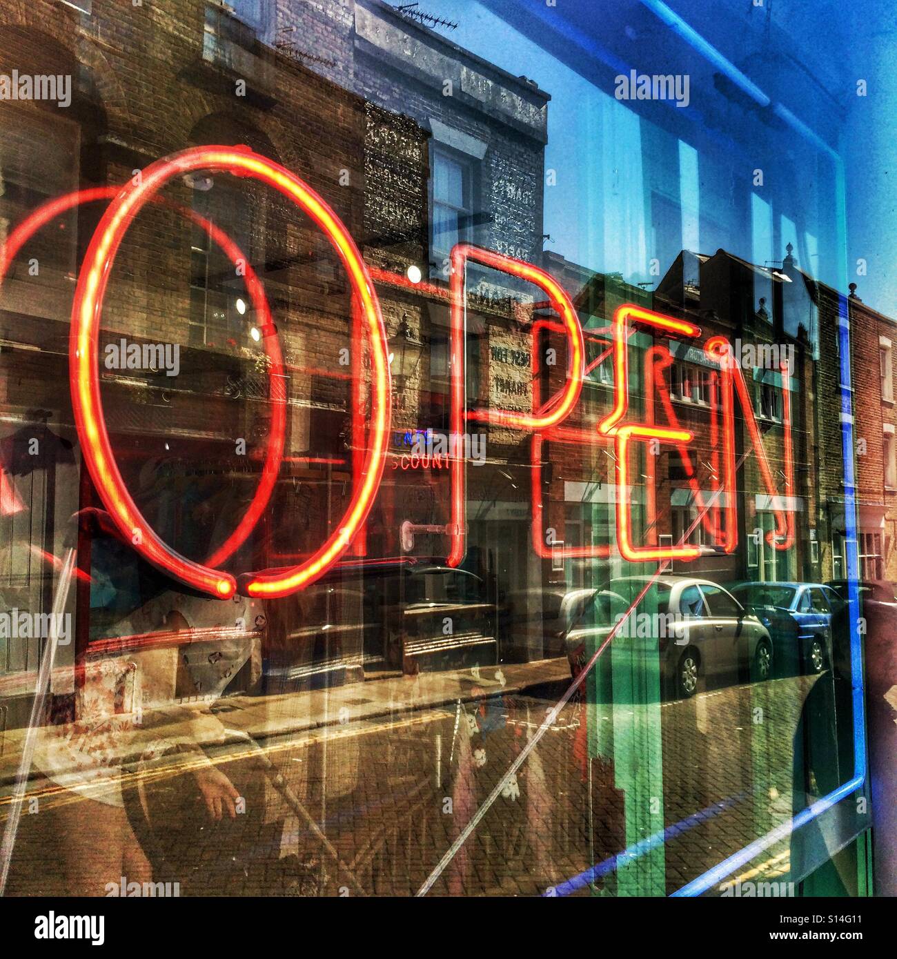A retro shop sign with window reflections - Smartphone Captured Stock Image
