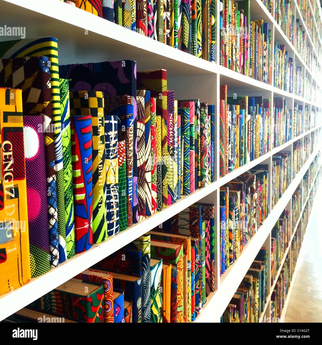 The British Library  a colourful book shelves installation artwork by Yinka Shonibare at the Turner Contemporary gallery in Margate England 2016 Stock Photo