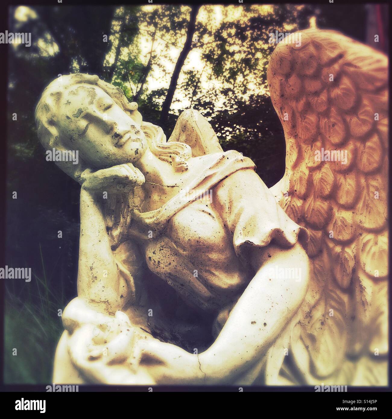 A statue of a napping angel. - Smartphone Captured Stock Image