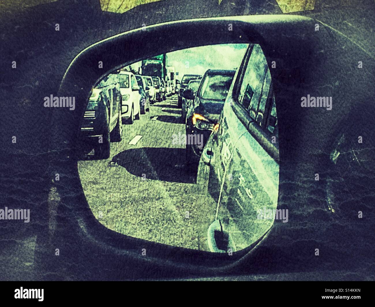 Travelling by car. Reflection in wing mirror of heavy traffic at a stand still on the A303 near Stonehenge. - Smartphone Captured Stock Image
