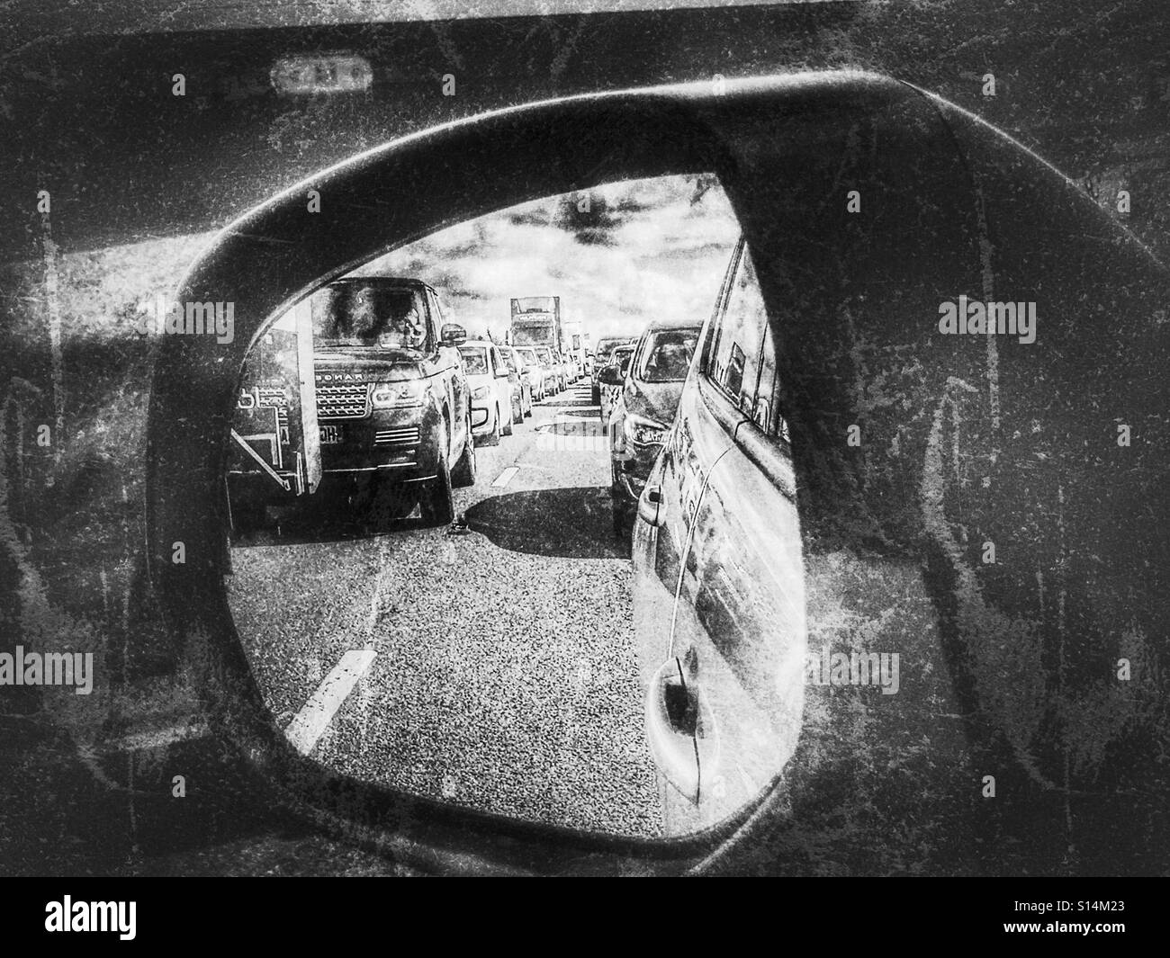 Traffic jam on the A303, reflected in the wing mirror of a car. Stock Photo