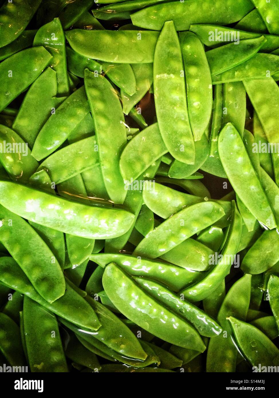 Mange tout from Peru, wash before use - Smartphone Captured Stock Image