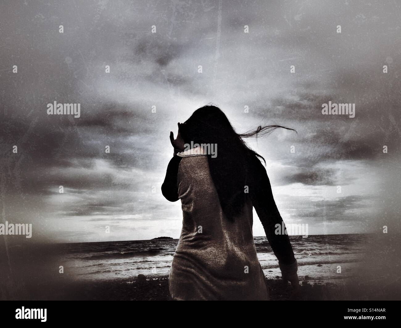 Woman and stormy sea hi-res stock photography and images - Alamy
