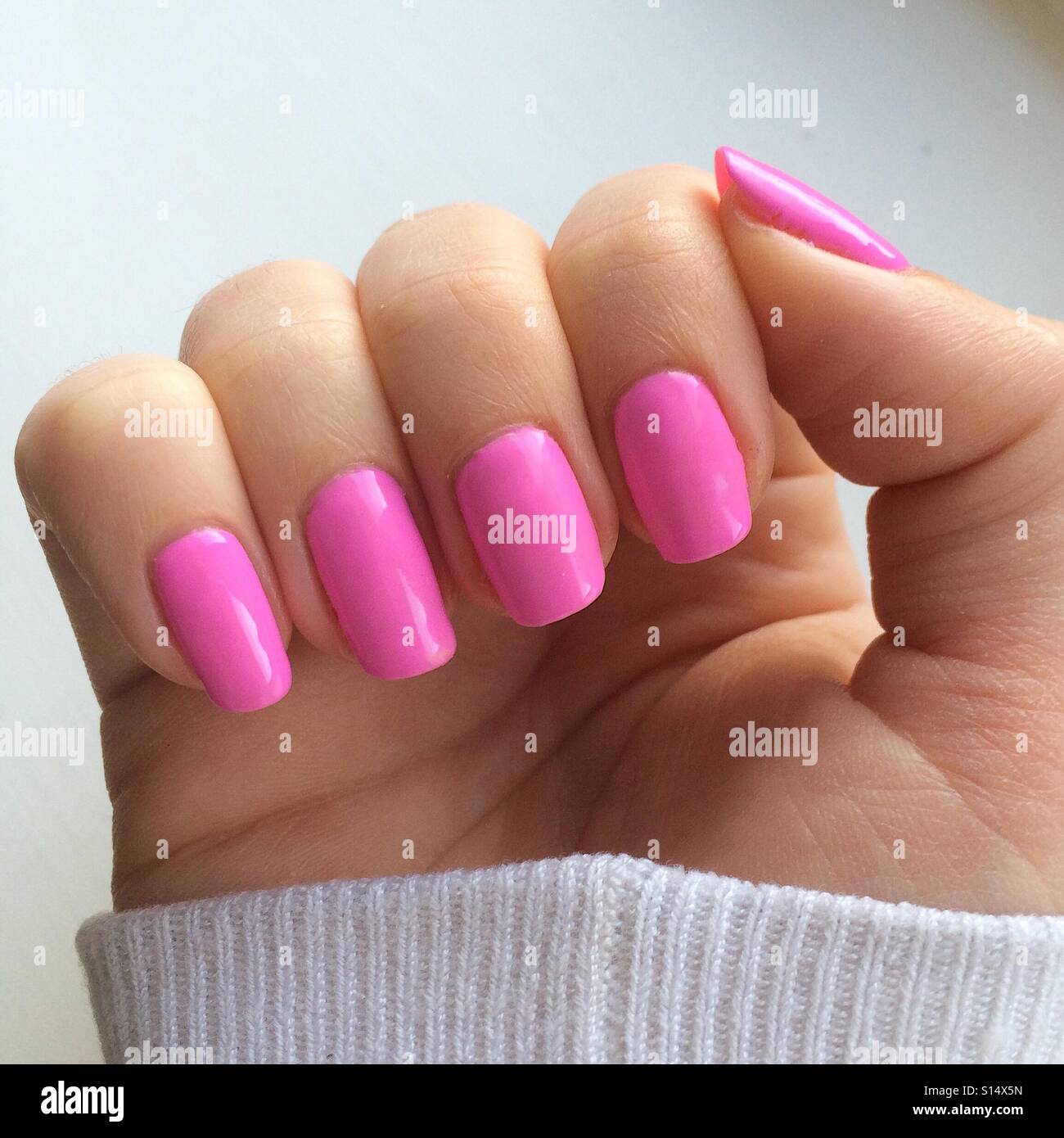 Bright pink nails hi-res stock photography and images - Alamy
