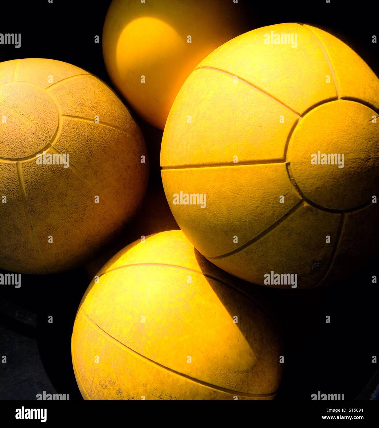 Yellow medicine balls Stock Photo Alamy