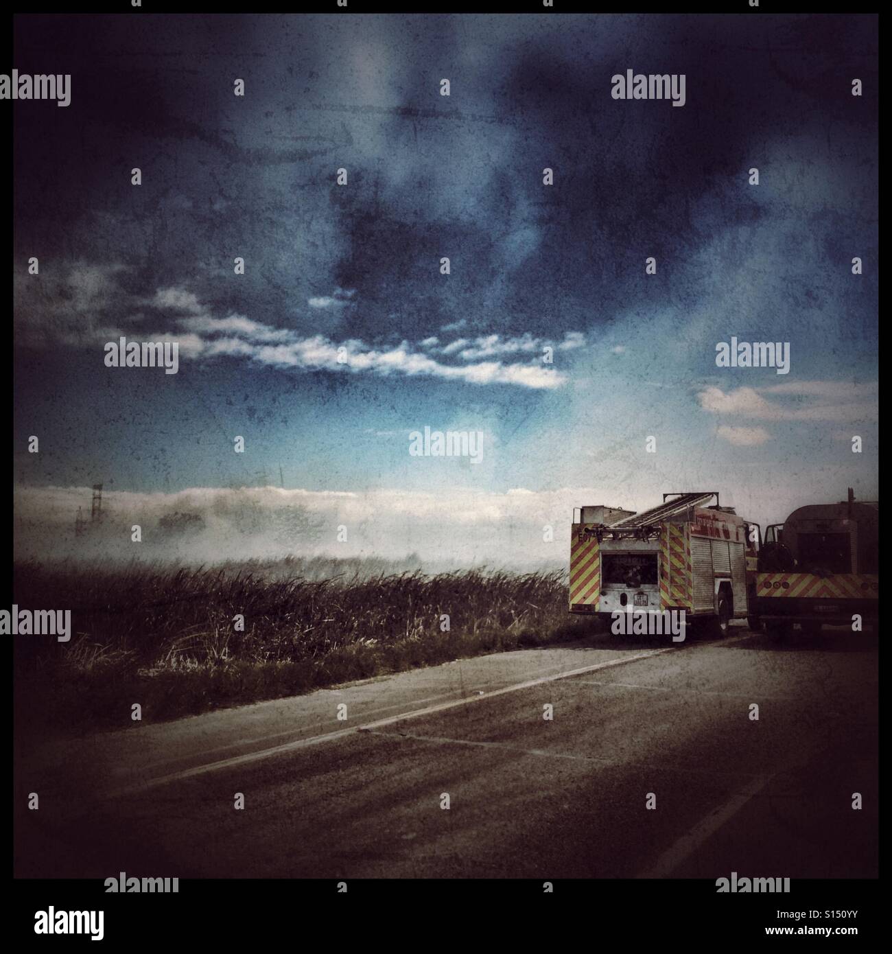 Fire and rescue trucks on N2 highway, South Africa. Heavy use of filters. - Smartphone Captured Stock Image
